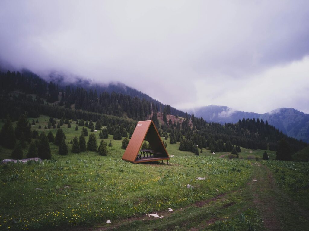 A tranquil campsite nestled in the foggy mountains of Almaty, Kazakhstan. Perfect for nature enthusiasts.