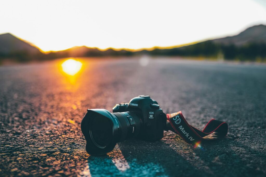 Canon EOS 5D Mark IV on a road at sunrise, showcasing natural lighting and perspective.