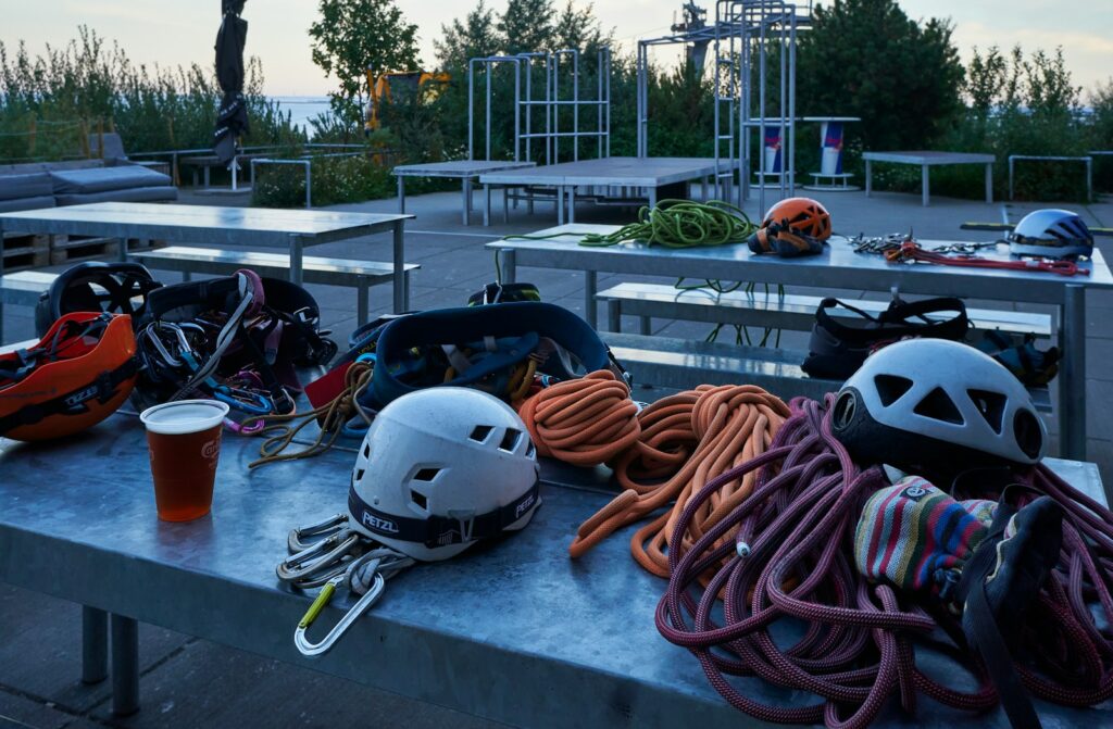 a table with a helmet and a drink on it