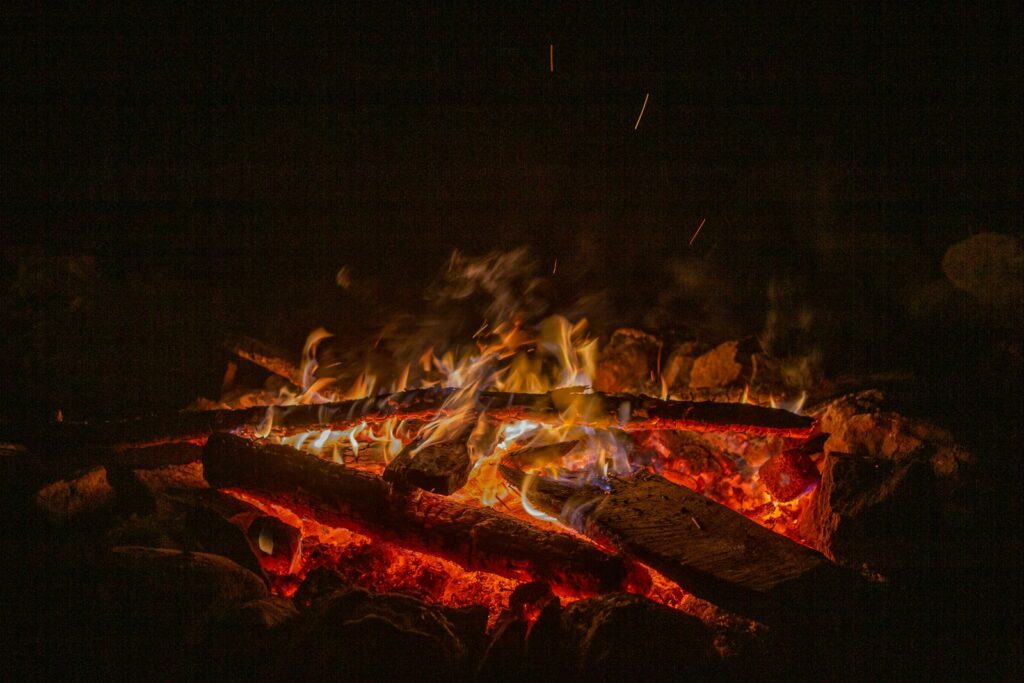 a fire burning in a pit