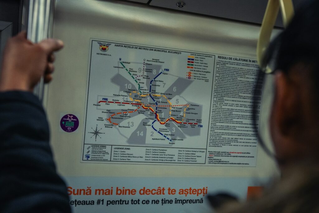 A person is looking at a map on a wall