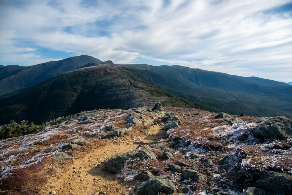 a view of a mountain with a trail going through it