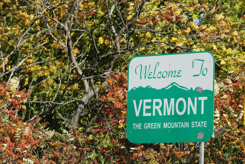 a sign in front of a tree