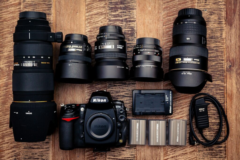 black nikon dslr camera on brown wooden table
