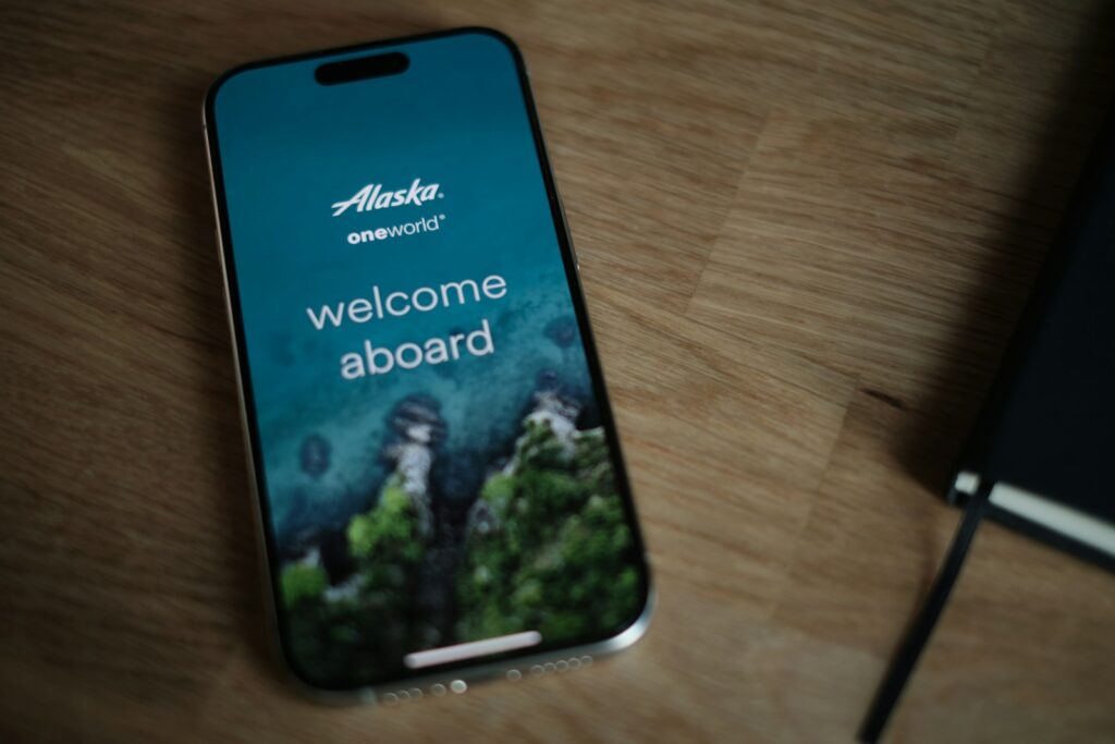 A cell phone sitting on top of a wooden table