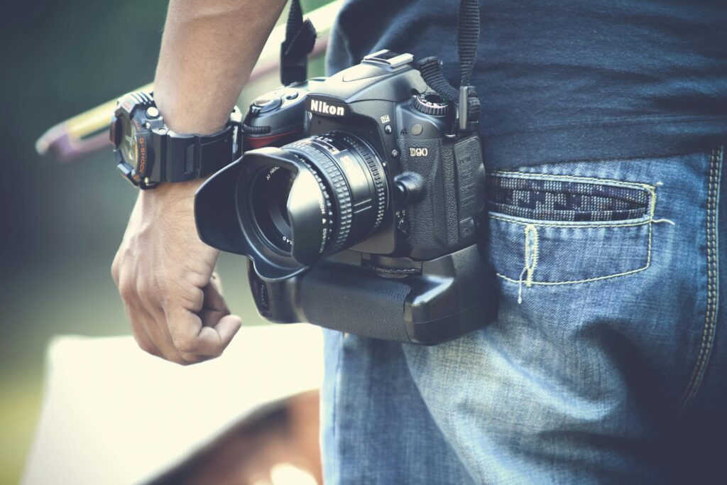 A person holds a camera in their pocket, ready to capture moments while on the go.