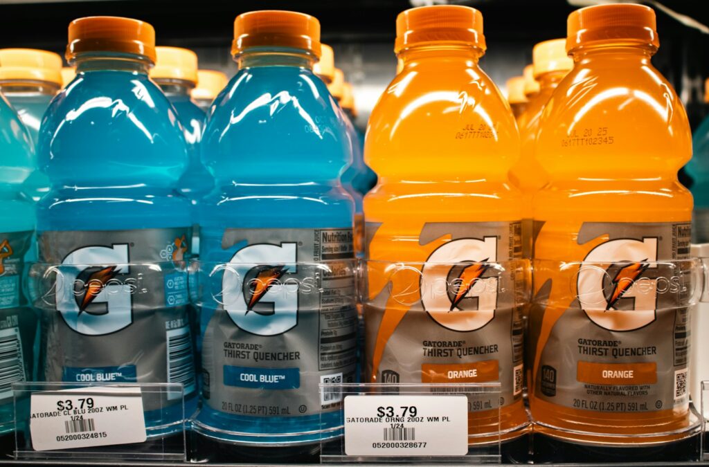 Gatorade bottles are stocked on a shelf.