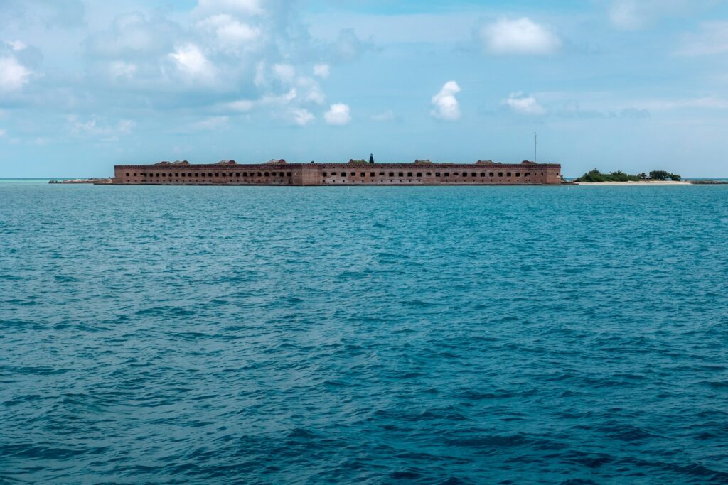 A large body of water with a building in the background