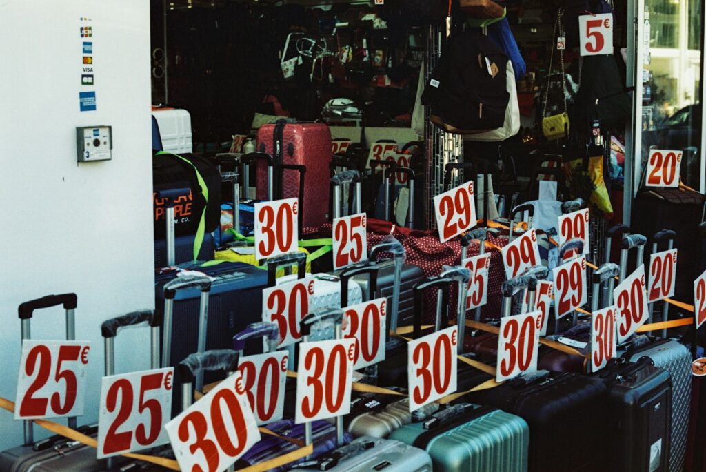 a number of suitcases for sale in a store