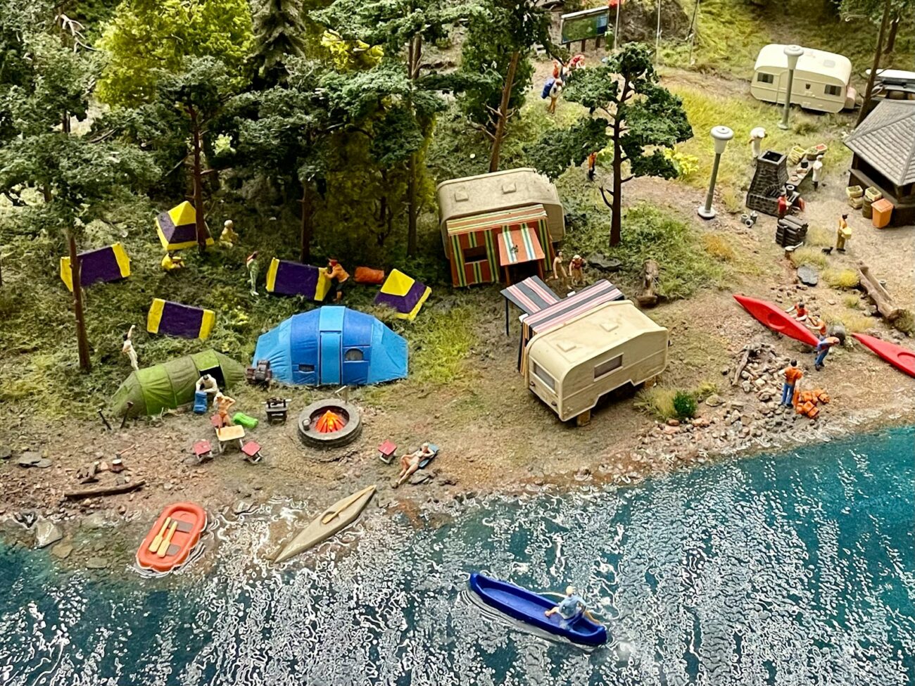 a small island with a lot of tents and boats